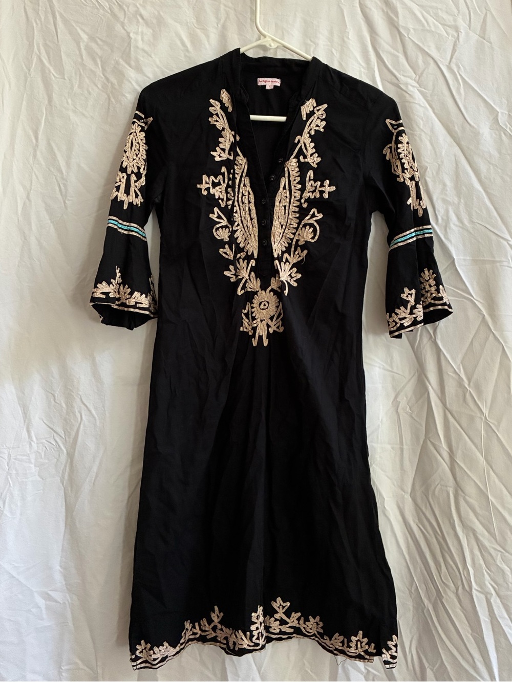 Black dress with gold and teal details